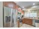 This kitchen features stainless appliances, a tile backsplash, and lots of cabinet space at 1853 W Estrella Dr, Chandler, AZ 85224