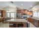 Well-equipped kitchen featuring stainless steel appliances, granite countertops, and a functional island at 1853 W Estrella Dr, Chandler, AZ 85224