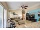Open living room featuring neutral tones, comfortable seating, and easy access to the backyard at 1853 W Estrella Dr, Chandler, AZ 85224