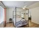 Relaxing main bedroom with wood-look floors, a fan, and a mirrored closet at 1853 W Estrella Dr, Chandler, AZ 85224