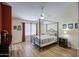 Bedroom with vaulted ceiling, ceiling fan, and ensuite bath at 1853 W Estrella Dr, Chandler, AZ 85224