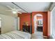 Spacious main bedroom with ensuite bathroom, wood-look floors, and a dark wood dresser at 1853 W Estrella Dr, Chandler, AZ 85224