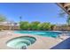 Inviting pool and spa combination in a private backyard setting with mature landscaping at 1853 W Estrella Dr, Chandler, AZ 85224