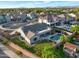 Aerial view of a home with a private pool, well-maintained yard, and solar panels on the roof at 18611 E Raven Dr, Queen Creek, AZ 85142