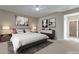 Serene bedroom with a plush bed, contemporary decor, and soft lighting for relaxation at 18611 E Raven Dr, Queen Creek, AZ 85142