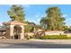 Welcome to Cortina, a beautiful community featuring lush landscaping, decorative stonework and attractive entrance signs at 18611 E Raven Dr, Queen Creek, AZ 85142