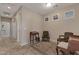 Hallway with decorative rug and furniture, neutral walls, and tile flooring leading to other rooms at 18611 E Raven Dr, Queen Creek, AZ 85142