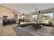 Spacious open-concept living room with a modern kitchen, dining area, and comfortable seating at 18611 E Raven Dr, Queen Creek, AZ 85142