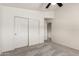 Bright bedroom with a ceiling fan and closet for ample storage space at 1920 E Belmont Dr, Tempe, AZ 85284