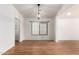 Dining area features hardwood floors, and a modern chandelier at 1920 E Belmont Dr, Tempe, AZ 85284