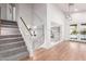 Bright foyer features hardwood floors, staircase, and a view of the pool through the French doors at 1920 E Belmont Dr, Tempe, AZ 85284