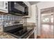 Updated kitchen featuring stainless steel appliances and granite countertops at 1920 E Belmont Dr, Tempe, AZ 85284