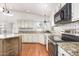 Well-appointed kitchen featuring an island, stainless appliances, and granite counters at 1920 E Belmont Dr, Tempe, AZ 85284
