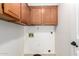 Laundry room with upper cabinets and wall hookups, ready for appliances at 1920 E Belmont Dr, Tempe, AZ 85284