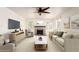 Cozy living room with a brick fireplace, ceiling fan, neutral palette, and ample seating at 1920 E Belmont Dr, Tempe, AZ 85284