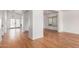 Open-concept living room with hardwood floors and lots of natural light at 1920 E Belmont Dr, Tempe, AZ 85284