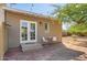 Cozy back patio with string lights, outdoor furniture, and a French door entrance, perfect for relaxing or entertaining outdoors at 2034 N Dayton St, Phoenix, AZ 85006