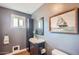 Bathroom featuring dark cabinets, a framed painting, and a neutral color palette at 2034 N Dayton St, Phoenix, AZ 85006