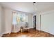 A tranquil bedroom with hardwood floors, natural light, and a comfortable rocking chair at 2034 N Dayton St, Phoenix, AZ 85006