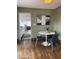 Contemporary dining area featuring a white table, modern blue chairs, and stylish wall art at 2034 N Dayton St, Phoenix, AZ 85006