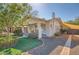 Charming home with a lush lawn, covered porch, and ample space for outdoor enjoyment at 2034 N Dayton St, Phoenix, AZ 85006