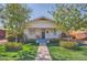 Charming bungalow with well-maintained lawn, mature trees, and inviting front porch at 2034 N Dayton St, Phoenix, AZ 85006