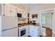 Efficient kitchen with white cabinets, granite countertops, and essential appliances at 2034 N Dayton St, Phoenix, AZ 85006