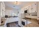Well-lit kitchen featuring white cabinets, granite countertops, and modern appliances at 2034 N Dayton St, Phoenix, AZ 85006