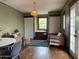 Charming living room with hardwood floors, storage, woven light fixture and cozy seating area at 2034 N Dayton St, Phoenix, AZ 85006
