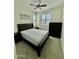 Cozy bedroom featuring a ceiling fan, carpet, a bed and dresser set, and windows with shutters at 20610 W Vermont Ave, Buckeye, AZ 85396
