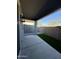 Back patio area with artificial turf, a concrete floor, and views of the surrounding area at 20610 W Vermont Ave, Buckeye, AZ 85396