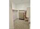 Walk-in closet with carpeted floor, wooden shelving, and a chest of drawers at 20610 W Vermont Ave, Buckeye, AZ 85396