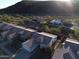 Aerial view of single-Gathering homes featuring tile roofs, desert landscaping, and attached two-car garages at 20822 N 42Nd. Ave, Glendale, AZ 85308