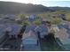 Aerial view of a single-Gathering home featuring a tile roof, desert landscaping, an attached two-car garage, and mountain views at 20822 N 42Nd. Ave, Glendale, AZ 85308