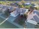 Aerial view of a single-Gathering home featuring desert landscaping, a tile roof, an attached two-car garage, and block fencing at 20822 N 42Nd. Ave, Glendale, AZ 85308