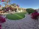 Beautiful backyard featuring a covered patio and artificial grass lawn at 20822 N 42Nd. Ave, Glendale, AZ 85308