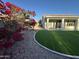 Beautiful backyard featuring a covered patio and artificial grass lawn at 20822 N 42Nd. Ave, Glendale, AZ 85308