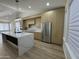 Open kitchen showcases a large island, stainless steel appliances, and light wood cabinets at 20822 N 42Nd. Ave, Glendale, AZ 85308