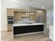 Modern kitchen with island, breakfast bar, stainless appliances, marble counters and backsplash, plus modern cabinets at 20822 N 42Nd. Ave, Glendale, AZ 85308
