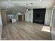 Bright living room showcasing the fireplace feature, recessed lighting, ceiling fan and wood-style laminate flooring at 20822 N 42Nd. Ave, Glendale, AZ 85308