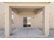 A covered back patio with a concrete floor, providing a comfortable outdoor space for relaxing and entertaining at 21572 W Sonora St, Buckeye, AZ 85326