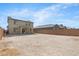 Expansive backyard with block wall fencing and patio, offering ample space for outdoor activities and landscaping at 21572 W Sonora St, Buckeye, AZ 85326