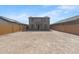 A vast backyard features block fencing, providing privacy and ample space for outdoor activities and recreation at 21572 W Sonora St, Buckeye, AZ 85326