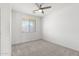 Bright bedroom with a ceiling fan, and carpet flooring at 21572 W Sonora St, Buckeye, AZ 85326