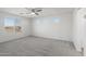 Spacious bedroom filled with light from a large window and two smaller windows at 21572 W Sonora St, Buckeye, AZ 85326