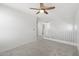 Upstairs landing with a ceiling fan and stair railing at 21572 W Sonora St, Buckeye, AZ 85326