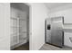 Kitchen pantry and stainless steel fridge at 21572 W Sonora St, Buckeye, AZ 85326