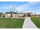 Community playground with covered picnic area, lush landscaping and walking paths at 21572 W Sonora St, Buckeye, AZ 85326