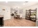 Open-concept dining room with a wooden table, stylish seating, and decorative shelving, perfect for entertaining at 2246 E Glenrosa Ave, Phoenix, AZ 85016