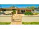 Inviting home exterior with a decorative metal gate, cozy seating area, and well-maintained landscaping at 2246 E Glenrosa Ave, Phoenix, AZ 85016